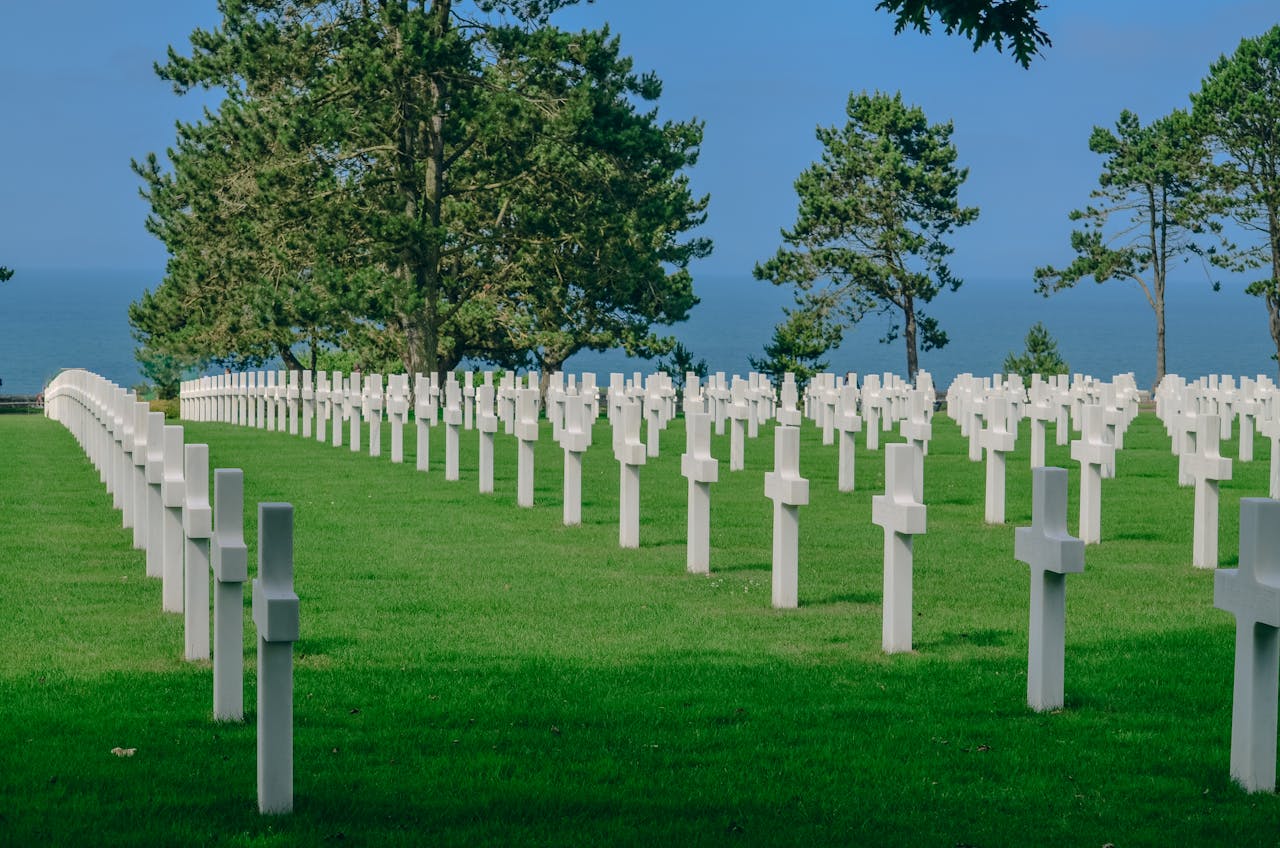 The Art of Drawing Readers In: Your attractive post title goes here A solemn view of the Normandy American Cemetery, honoring WWII soldiers with rows of crosses by Omaha Beach.